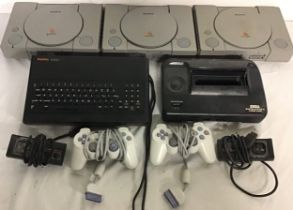 VARIOUS GAMING DEVICE CONSOLES. Here we find 3 x Sony PlayStations - Sega Master System power base