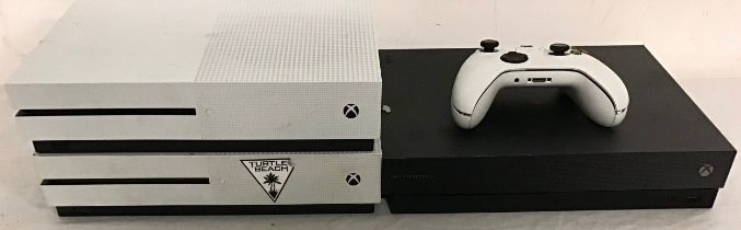 XBOX CONSOLES AND CONTROLLER. 3 Xboxes here models Xbox One X and 2 x Xbox One S machines complete