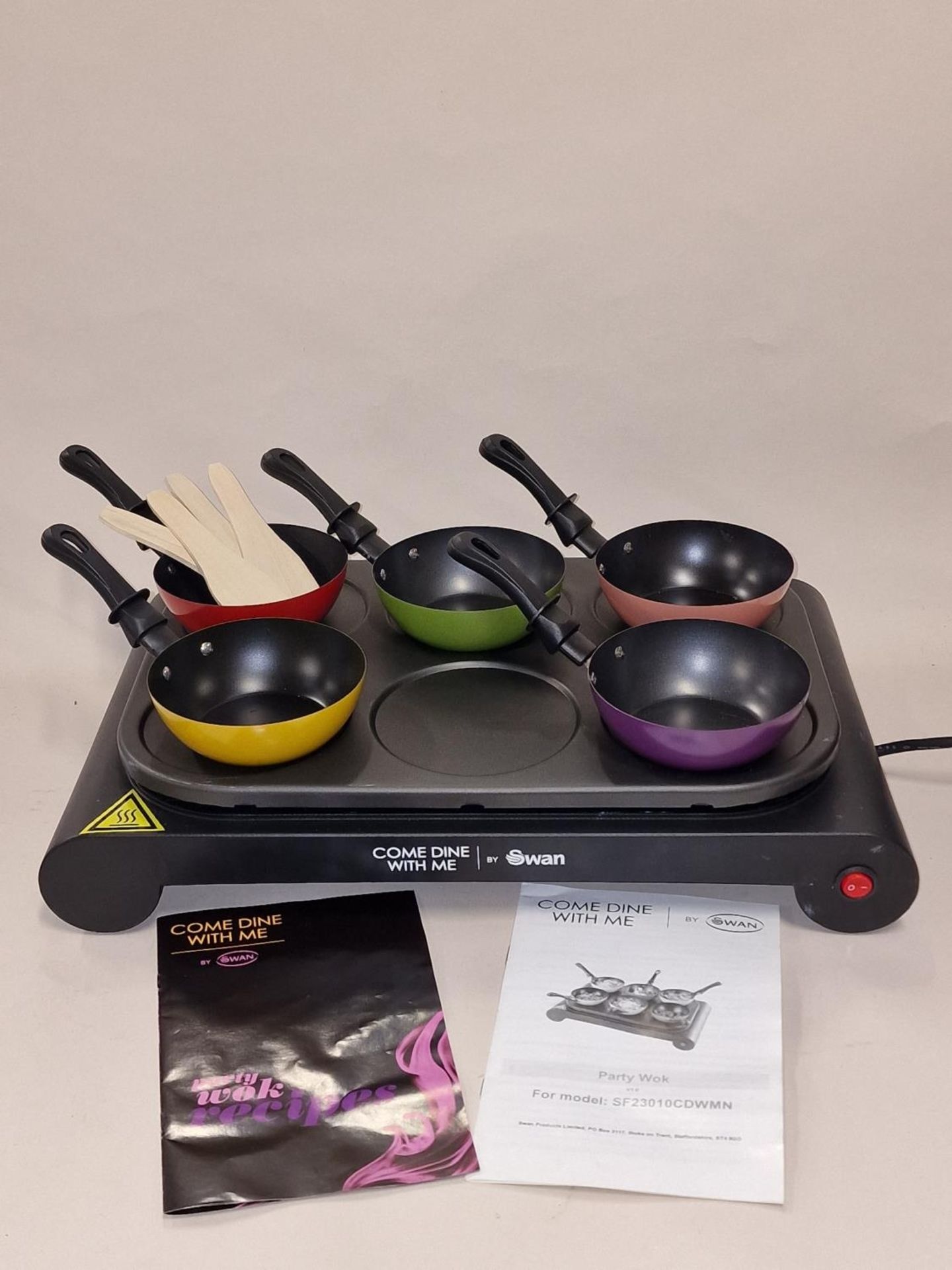 A come dine with me Party Wok with Pans and wooden utensils and manuals.