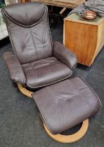 Contemporary designer leather recliner armchair with matching footstool.