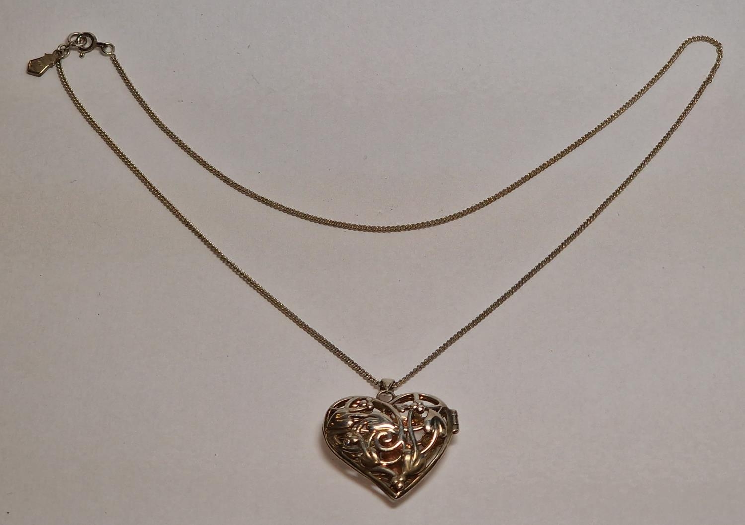 Clogau Welsh gold angel inside silver locket and chain.