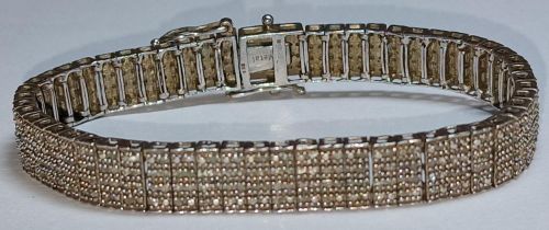 A Diamond set silver bracelet.