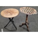 A vintage wooden occasional table with chessboard top together with another table on a tripod