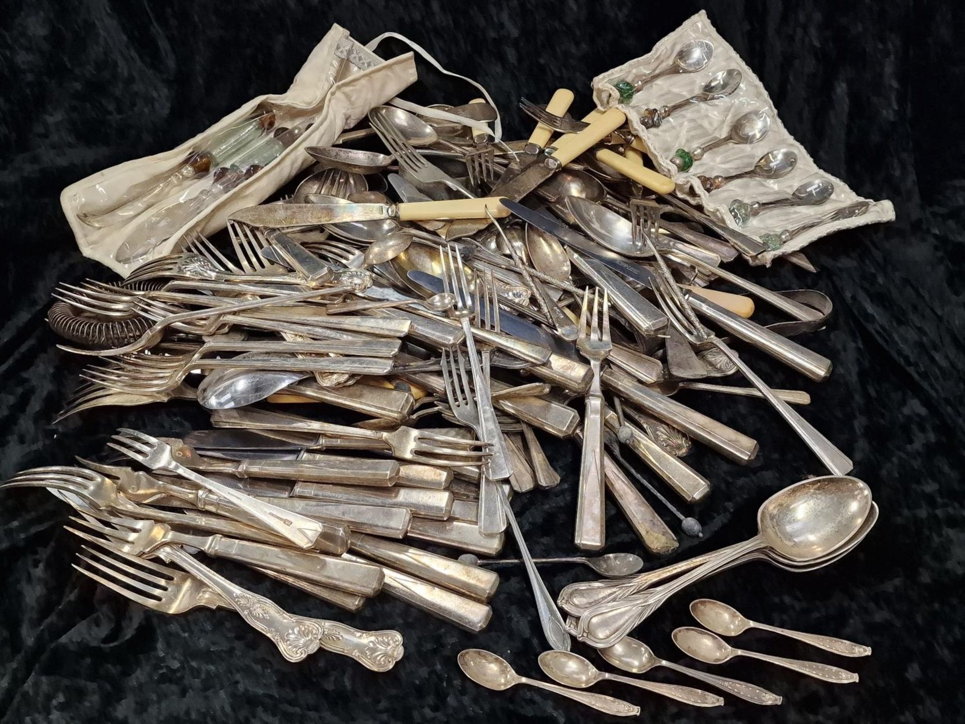 Large collection of silver and silver plated flatware to include set of five silver teaspoons and
