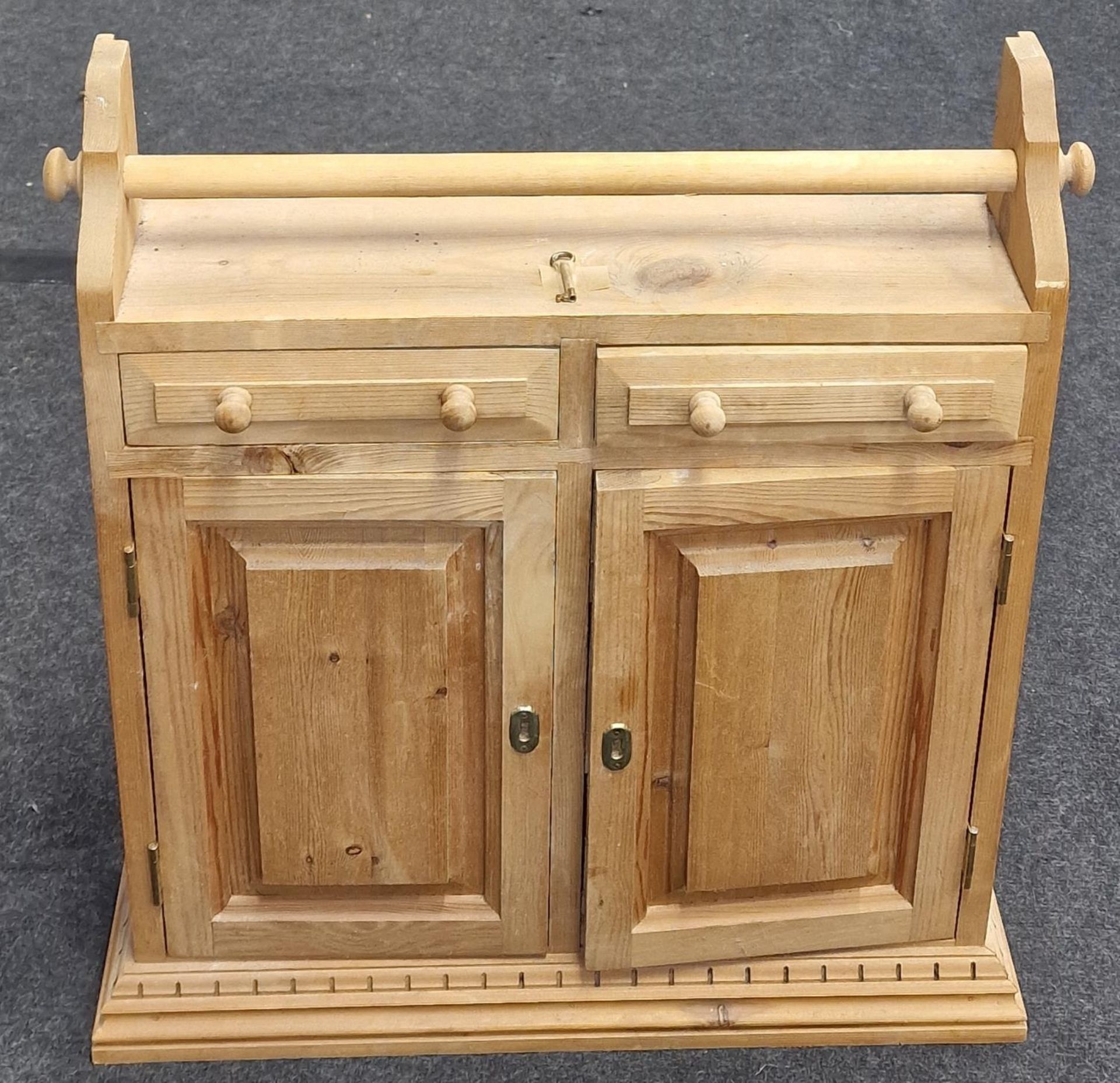 A modern pine kitchen wall mounted storage rack/cupboard.