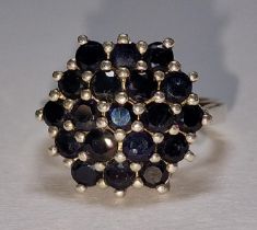 A large 925 silver and sapphire cluster ring Size K