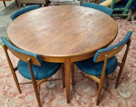 G Plan Fresco vintage teak extending circular dining table together with four chairs.