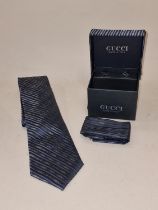 Gucci Italy gents boxed tie, handkerchief and cuff links set.