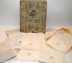 A collection of antique white linin servants aprons as supplied by Harrods in a Harrods box.