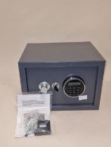 An electronic combination safe with keys and paperwork.