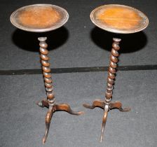 A matching pair of antique mahogany plant stands with barley twist columns and tripod feet. 85cms
