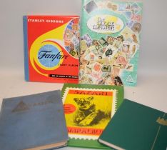 A number of vintage schoolboy stamp albums with a good selection of world stamps