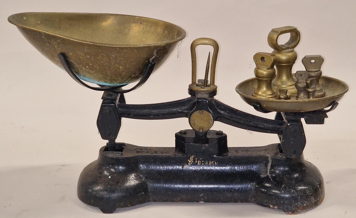 Vintage cast metal set of sweet shop weighing scales to include brass weights.