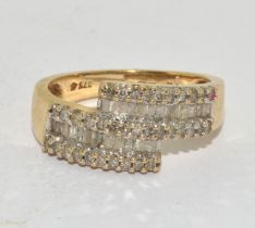 9ct gold ladies Diamond twist ring set with baguette cut diamonds and H/M in ring as 0.5ct size M
