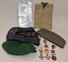 Collection of militaria items to include medals, hats, map holder etc.