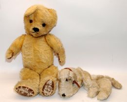 Vintage large jointed teddy with leather pads c/w a vintage pyjama case in the form of a dog. No