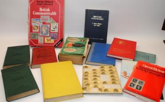 A quantity of vintage stamp collection reference books including early examples