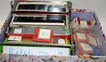 Box containing a large quantity of stamp mounts, individual and strips.