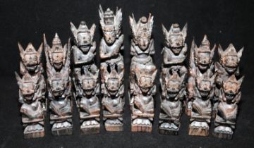 Vintage carved wood Indonesian Deity chess set. Largest piece is 13cms tall