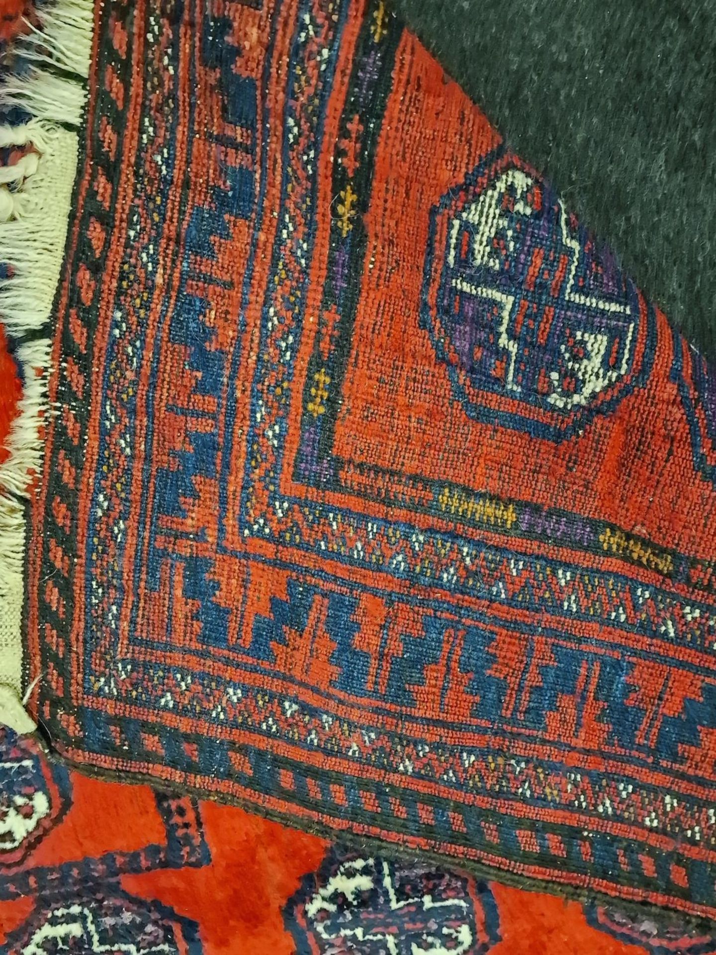 A group of three vintage carpets to include a Bokhara and a Chinese example. - Image 3 of 6