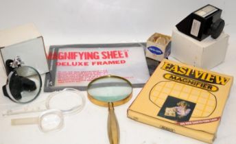 An assortment of magnifiers and visual aids for collectors close up work