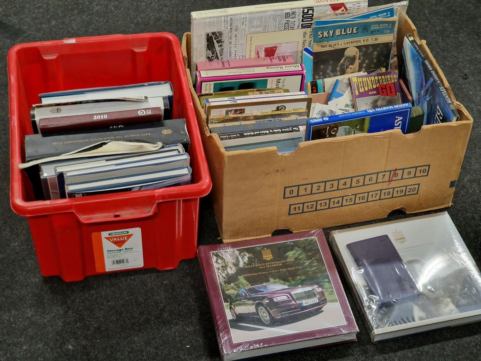 Two boxes of vintage and modern mainly car related books to include some sealed Rolls Royce