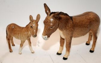 2 x Beswick Donkeys, adult and foal. the largest being 13cms tall