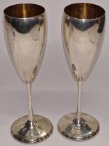 A pair of French silver gold gilt champagne flutes 800 silver. Total weight 217g.