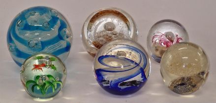 A collection of six paperweights to include 2 x Selkirk and 4 x Murano.