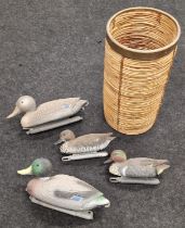 Group of four plastic decoy ducks together with a possibly Willow stick stand (5).