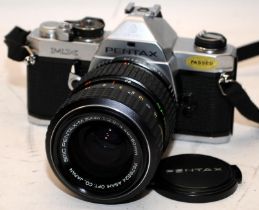 Pentax MX 35mm film SLR camera c/w SMC-Pentax-M 01:2.8/4 40-80mm zoom lens and protective case. In