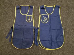 2 x blue with yellow trim tabards bearing the Tottenham Hotspur crest