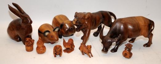 Collection of wooden carved animals of the Chinese Zodiac, all present except horse and goat, some