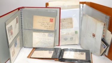 Three folders containing a collection First Day Covers, Telegrams and used envelopes from around the