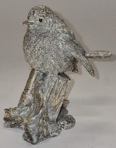 A sterling silver sculpture of a robin.