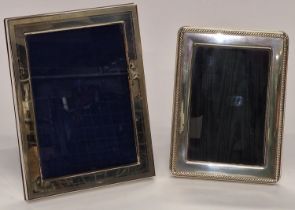 Two silver photo frames one made by Carrs.