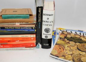 A collection of reference books relating to stamp and coin collecting