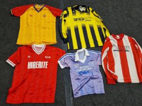 A collection of vintage football jerseys including Brighton, Bristol City and Wigan Athletic. 5 in