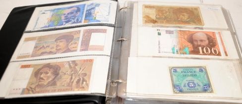 An album of world banknotes sorted alphabetically: Finland to Indonesia