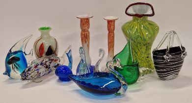 A collection of coloured glass to include a torso vase, hand bag vase, swans and other