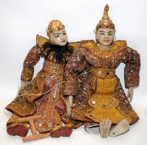 Two vintage Indonesian prince and princess puppets in traditional dress. Approx 50cms tall