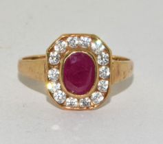 9ct gold ladies Ruby ring set in a square Halo design size O