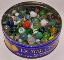 A tin of marbles. Assorted sizes and conditions.