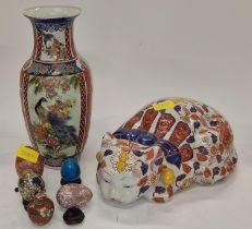 An oriental vase together with a ceramic cat and some other pieces.