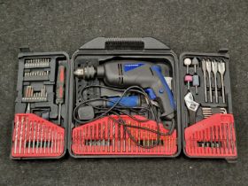 A cased power drill set with drill bits etc.