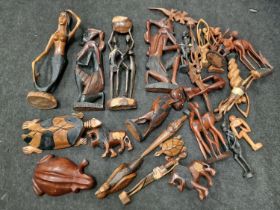 Large collection of carved wooden figures to include animals.