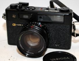 Vintage Yahica Electro 35 GT 35mm compact film camera c/w protective case. In excellent cosmetic