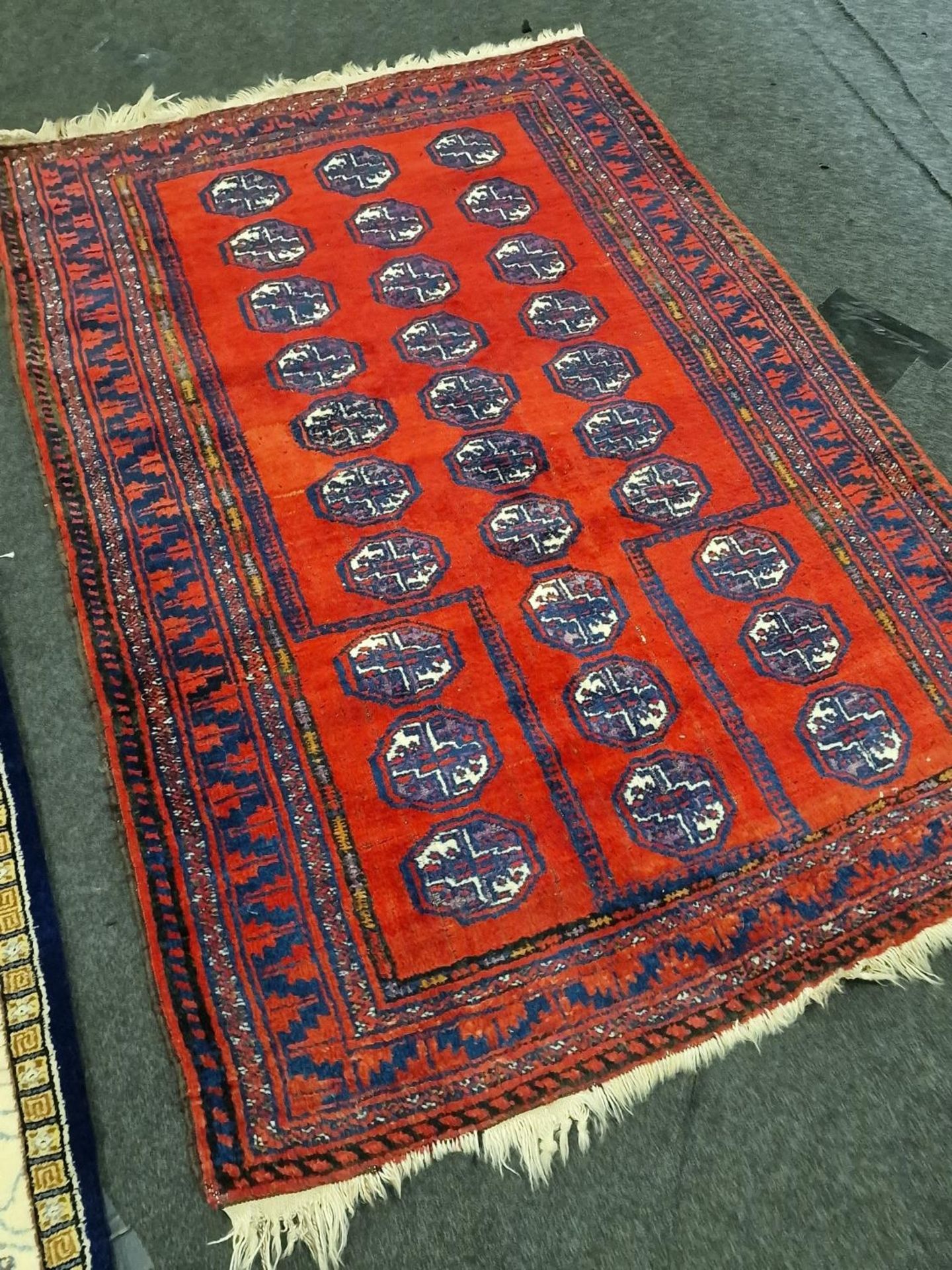 A group of three vintage carpets to include a Bokhara and a Chinese example. - Image 2 of 6
