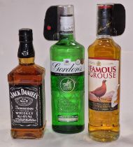 Three bottles of alcohol: Jack Daniel's 70cl, Gordon's Gin 70cl and Famous Grouse 700ml (REF 20,