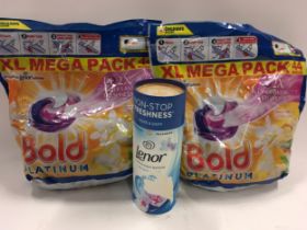 A lenor scent booster and two mega packs of 44 Bold Platinum washing pods. (8)